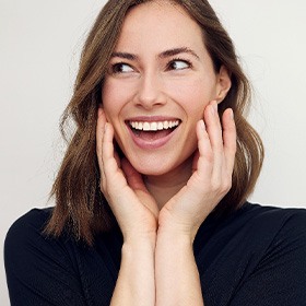 a woman showing off her healthy smile