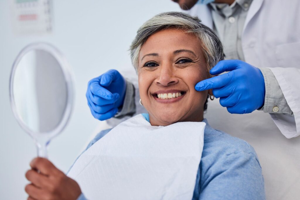 A woman smiling at the dentist's office.